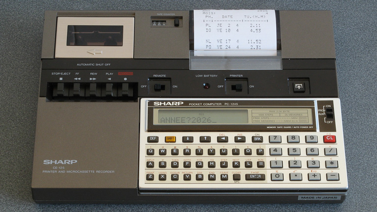 Photo of a Sharp PC-1245 running a moon phase calculation program