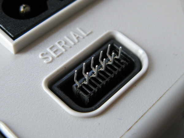 Testing the fit of the connector inside the Dreamcast serial port
